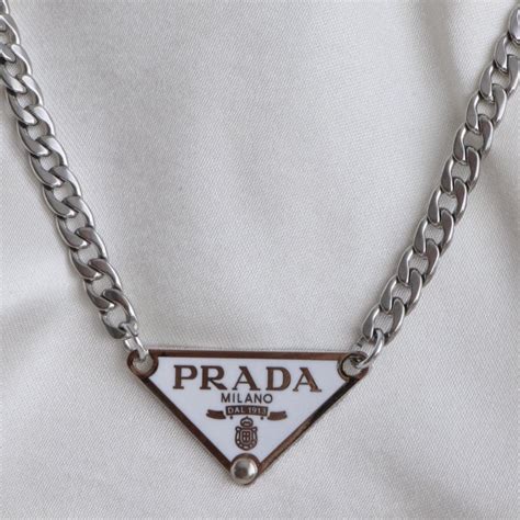 prada silver necklace|ring with a teara prada.